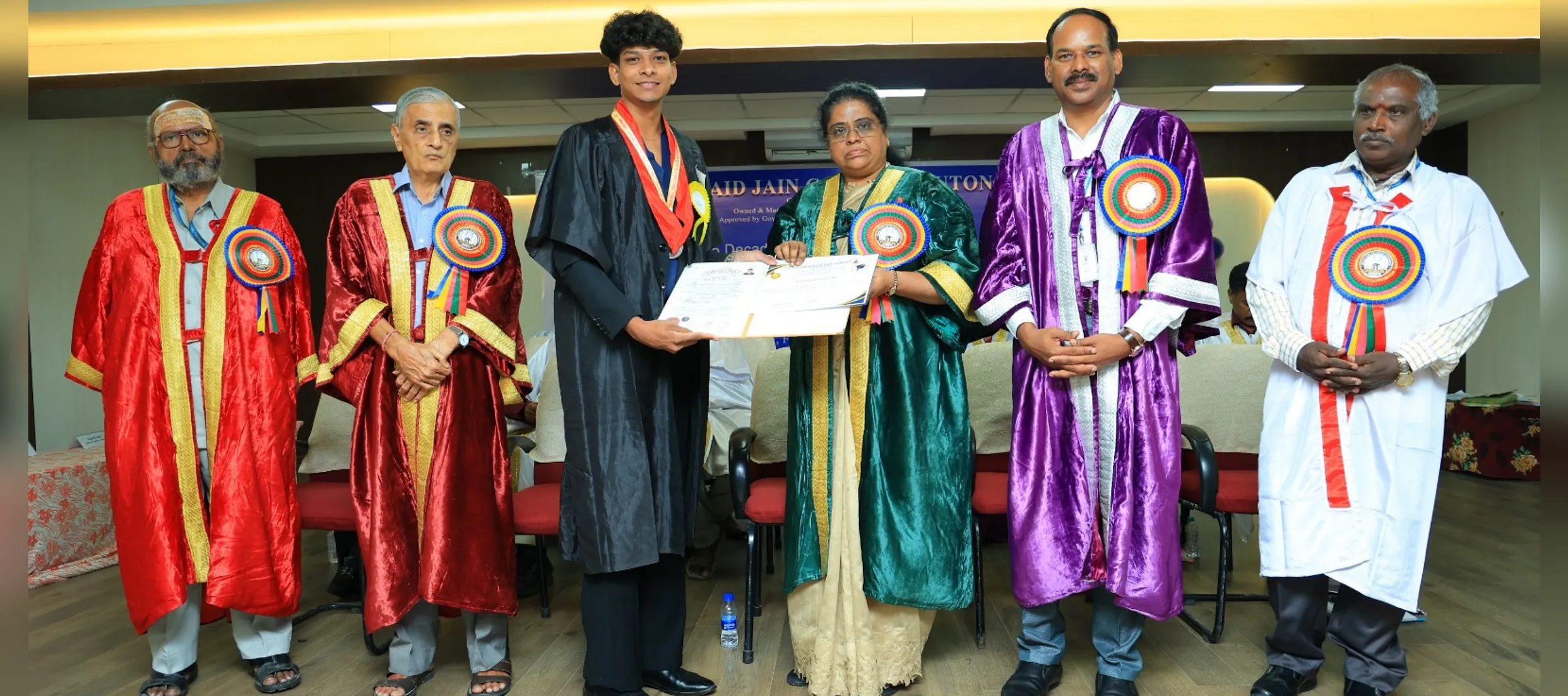 Graduate receiving a degree certificate at the 51st Graduation Day